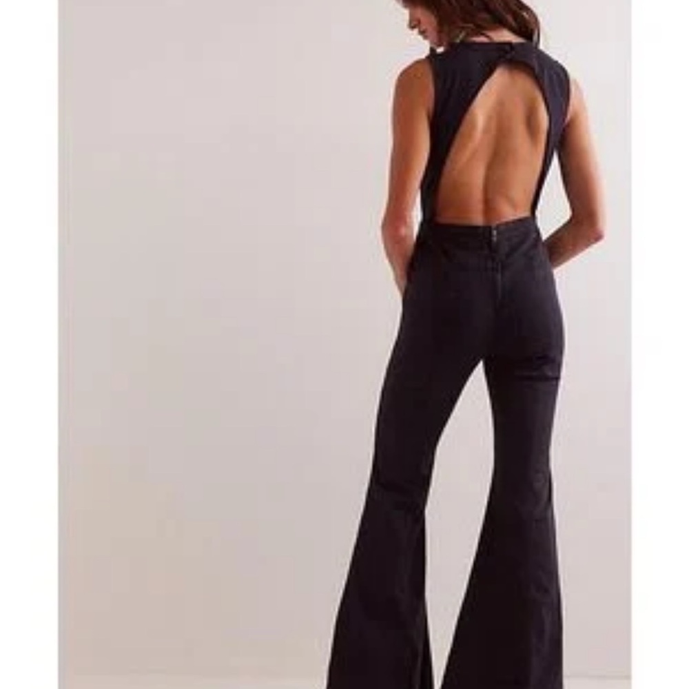 Free people We the free cayenne jumpsuit. Black denim NWT Size 28